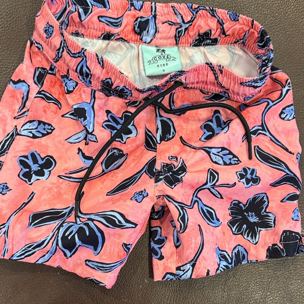 •COVE Coral and Blue swim trunks